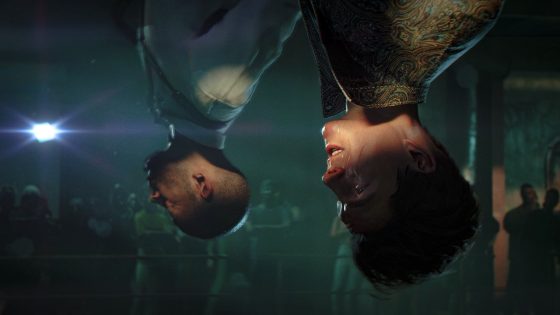 007 First Light screenshot showing two characters upside down in a cinematic scene from the PS5 Pro PSSR showcase